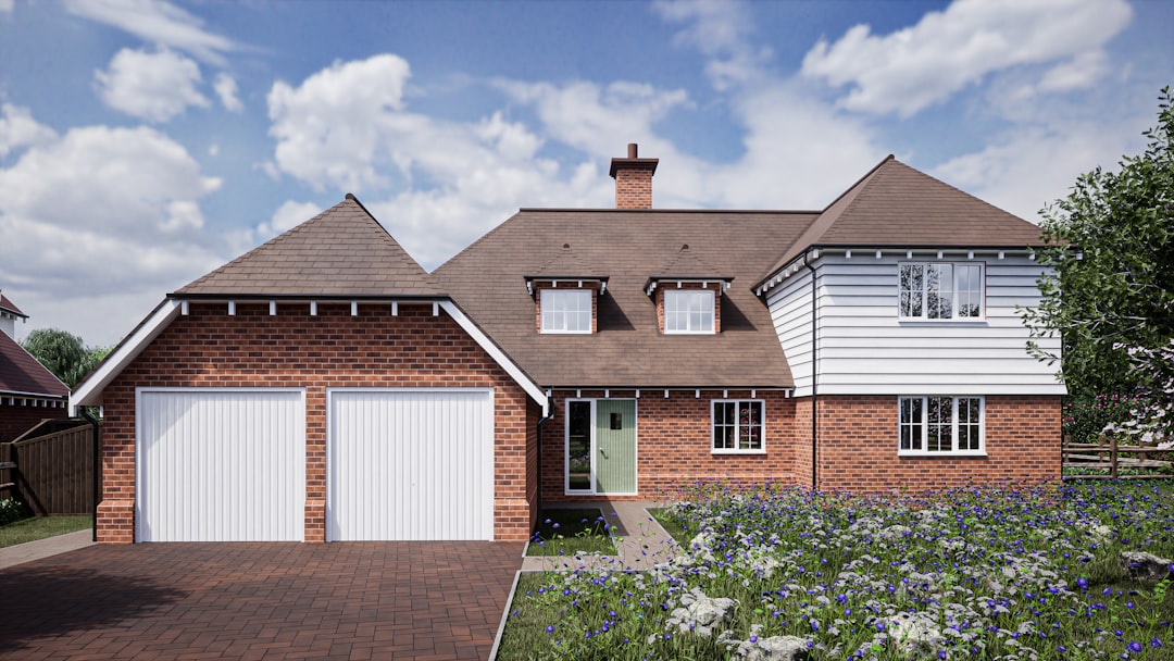 a-large-brick-house-with-two-garage-doors-hjwqyomgvny